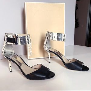 Black leather and white snakeskin print sandals